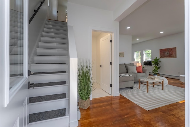 14 Staples St, Kingston, NY 12401 - stairs with wood finished floors, recessed lighting, and a baseboard heating unit