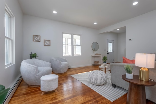 14 Staples St, Kingston, NY 12401 - living room featuring a baseboard heating unit, wood finished floors, and recessed lighting