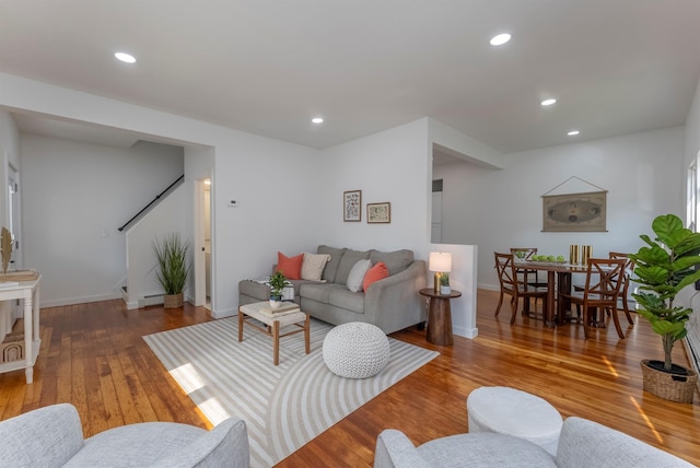 14 Staples St, Kingston, NY 12401 - living area featuring stairs, wood finished floors, recessed lighting, and baseboard heating