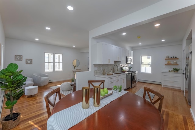 14 Staples St, Kingston, NY 12401 - dining space featuring baseboard heating, recessed lighting, and light wood finished floors