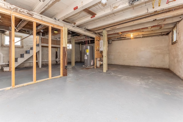 14 Staples St, Kingston, NY 12401 - below grade area featuring electric water heater and stairway