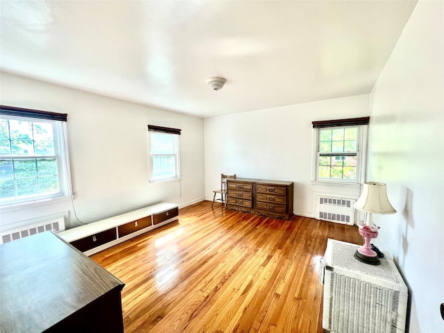 41 Derby Ave, Cedarhurst, NY 11516 - bedroom featuring radiator heating unit and wood finished floors