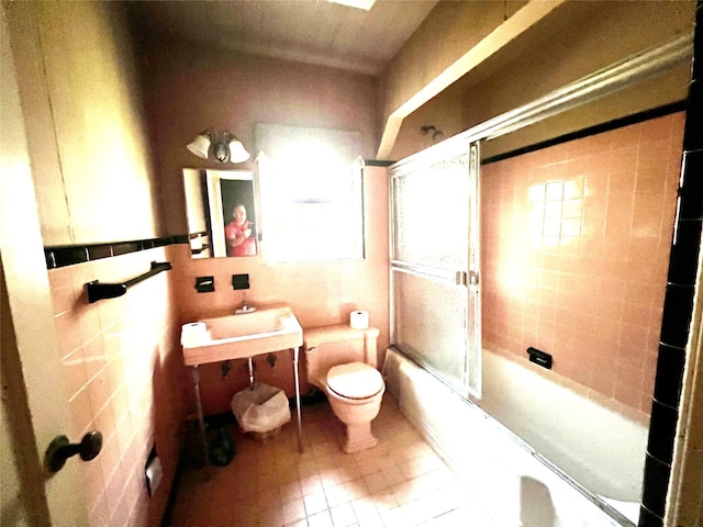 41 Derby Ave, Cedarhurst, NY 11516 - full bath with shower / bath combination with glass door, vanity, tile walls, and tile patterned floors