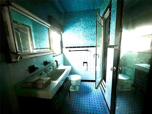 41 Derby Ave, Cedarhurst, NY 11516 - bathroom with tile walls, a shower stall, and tile patterned floors