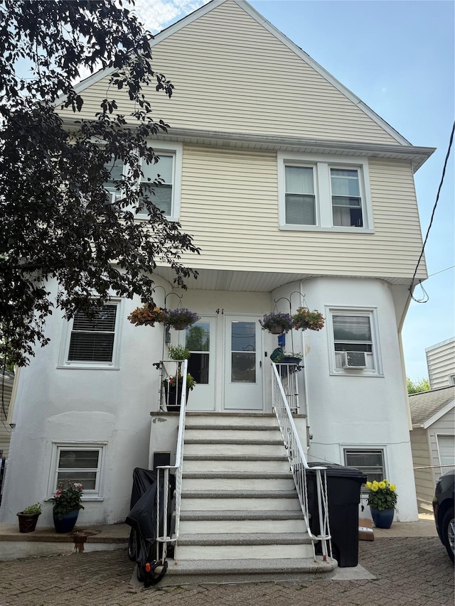 41 Chestnut St, Tuckahoe, NY 10707 - view of front of home featuring cooling unit and stucco siding