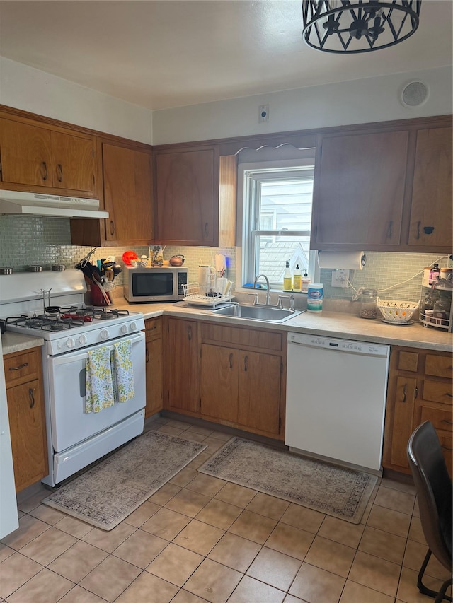 41 Chestnut St, Tuckahoe, NY 10707 - kitchen featuring white appliances, under cabinet range hood, decorative backsplash, and light countertops
