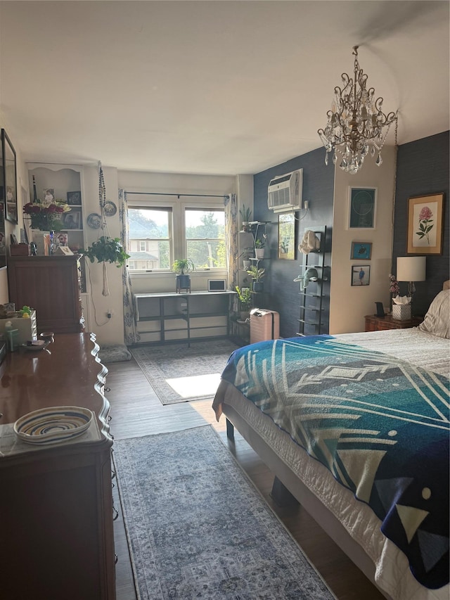 41 Chestnut St, Tuckahoe, NY 10707 - bedroom with wood finished floors, a chandelier, and a wall mounted AC