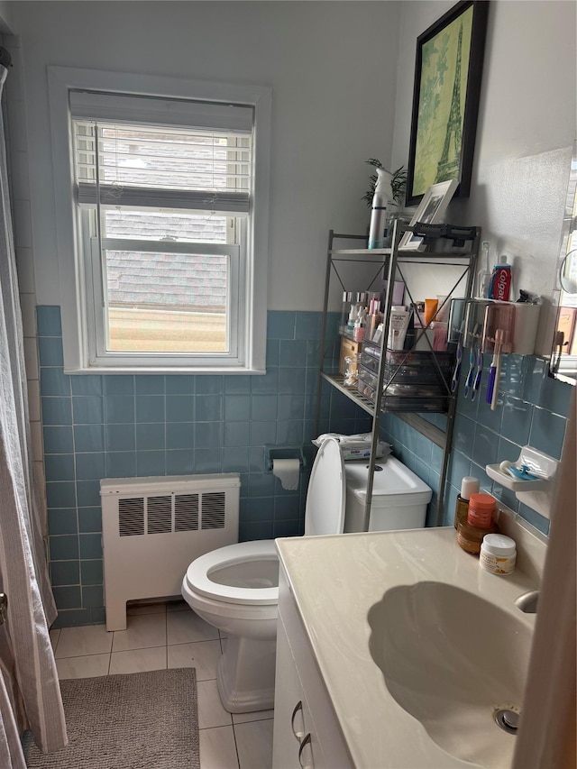 41 Chestnut St, Tuckahoe, NY 10707 - bathroom featuring radiator, tile walls, tile patterned flooring, vanity, and a shower with curtain