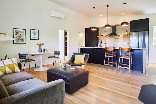 224 Upper Lumber Rd, Glen Spey, NY 12737 - living area featuring a wall mounted air conditioner, light wood-type flooring, recessed lighting, and a towering ceiling