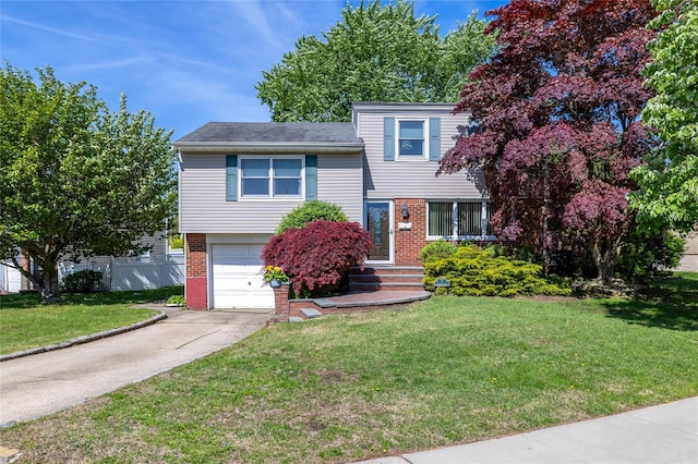 7 Garnet Ln, Plainview, NY 11803 - split level home featuring brick siding, an attached garage, and concrete driveway