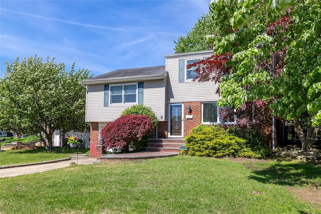 7 Garnet Ln, Plainview, NY 11803 - tri-level home featuring brick siding and a front lawn