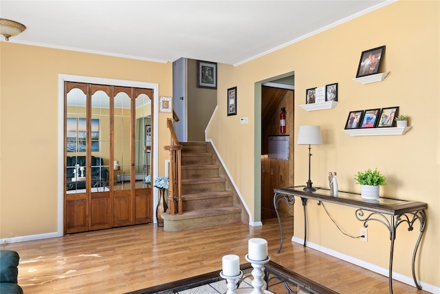 7 Garnet Ln, Plainview, NY 11803 - interior space with wood finished floors, crown molding, stairway, and a baseboard heating unit