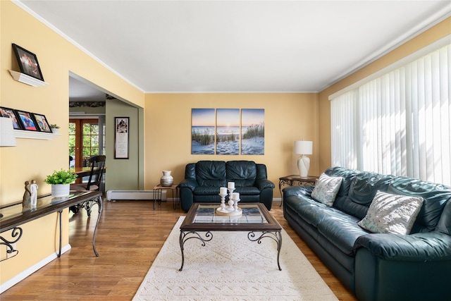 7 Garnet Ln, Plainview, NY 11803 - living area with a baseboard heating unit, wood finished floors, and ornamental molding