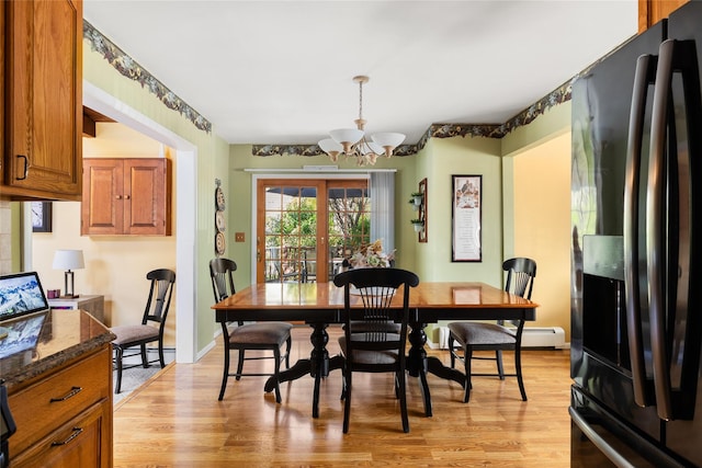 7 Garnet Ln, Plainview, NY 11803 - dining area featuring a chandelier and light wood-type flooring