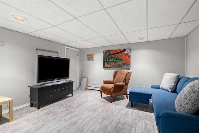 7 Garnet Ln, Plainview, NY 11803 - living room featuring wood finished floors, a paneled ceiling, and baseboard heating