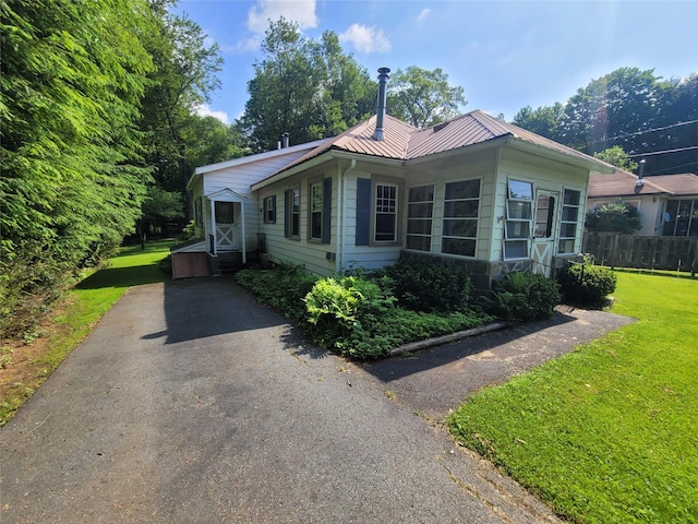 1485 Briscoe Rd, Swan Lake, NY 12783 - view of front facade featuring a metal roof and asphalt driveway
