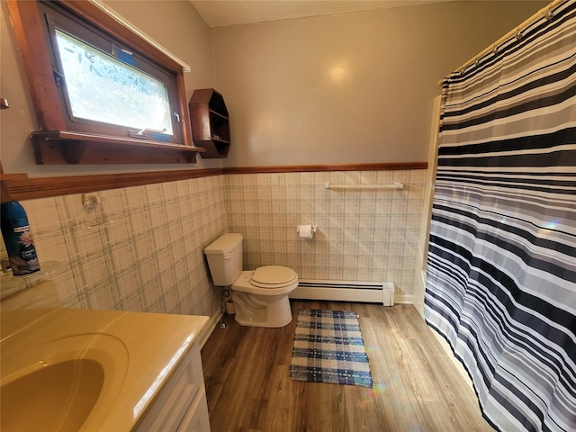 1485 Briscoe Rd, Swan Lake, NY 12783 - full bathroom with a baseboard radiator, wood finished floors, wainscoting, vanity, and a shower with curtain