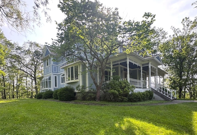 25 Lake Gilead Rd, Carmel, NY 10512 - view of home's exterior with a porch, a lawn, and stairway