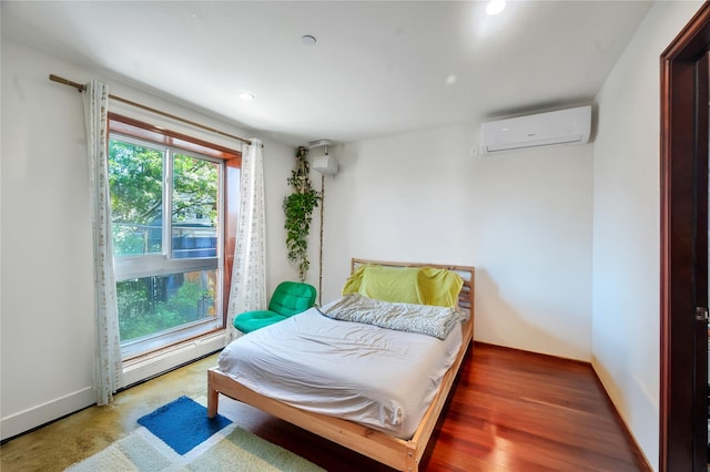 7425 43rd Ave Unit 2A, Elmhurst, NY 11373 - bedroom with a wall mounted AC, a baseboard radiator, and recessed lighting