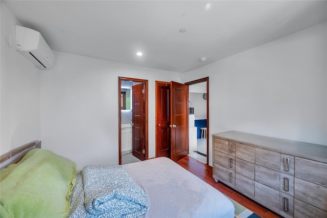 7425 43rd Ave Unit 2A, Elmhurst, NY 11373 - bedroom featuring an AC wall unit, dark wood-type flooring, and recessed lighting