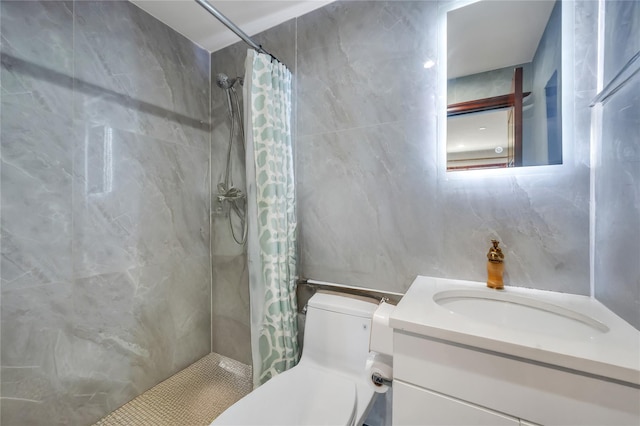 7425 43rd Ave Unit 2A, Elmhurst, NY 11373 - bathroom featuring tiled shower, vanity, and tile walls