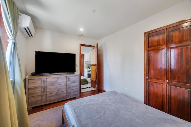 7425 43rd Ave Unit 2A, Elmhurst, NY 11373 - bedroom with a wall mounted AC, wood finished floors, and recessed lighting