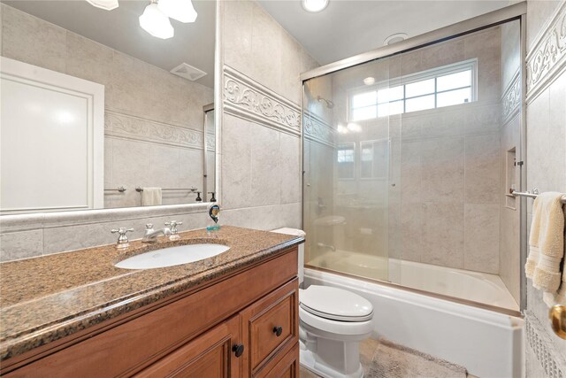 156 Lefferts Rd, Woodmere, NY 11598 - bathroom with vanity, enclosed tub / shower combo, tile walls, and tasteful backsplash