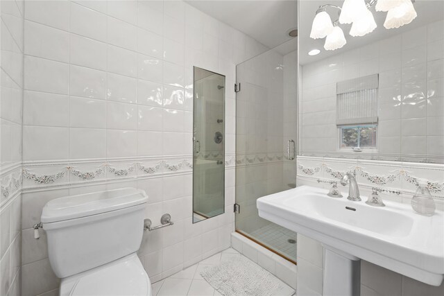 156 Lefferts Rd, Woodmere, NY 11598 - bathroom with tile walls, a stall shower, tile patterned flooring, and a chandelier