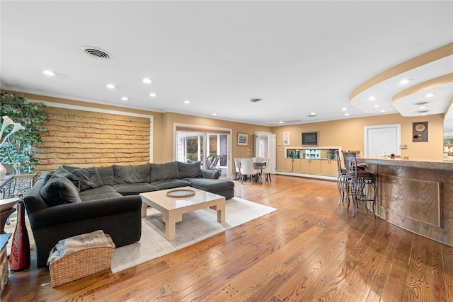 156 Lefferts Rd, Woodmere, NY 11598 - living area featuring crown molding, recessed lighting, light wood finished floors, and bar area