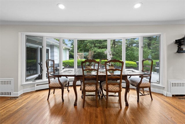 156 Lefferts Rd, Woodmere, NY 11598 - dining area featuring radiator, ornamental molding, and hardwood / wood-style floors