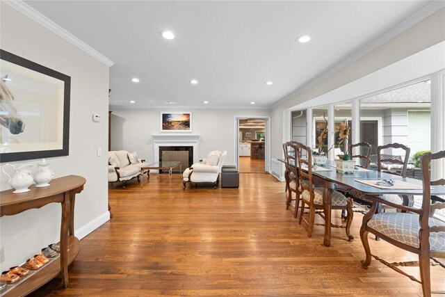 156 Lefferts Rd, Woodmere, NY 11598 - dining room with crown molding, recessed lighting, wood finished floors, and a fireplace