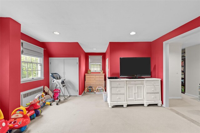 156 Lefferts Rd, Woodmere, NY 11598 - recreation room featuring carpet flooring, radiator heating unit, and recessed lighting