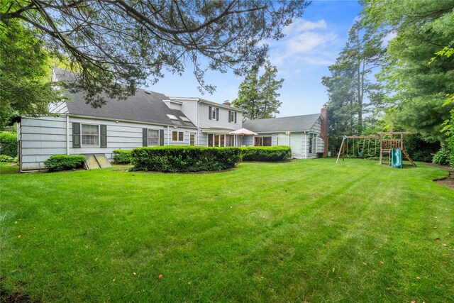 156 Lefferts Rd, Woodmere, NY 11598 - view of grassy yard with a playground