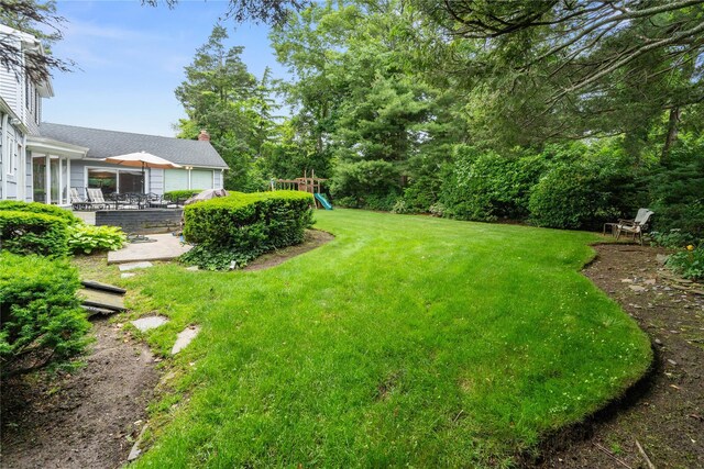 156 Lefferts Rd, Woodmere, NY 11598 - view of green lawn featuring a playground