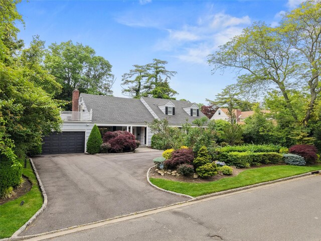 156 Lefferts Rd, Woodmere, NY 11598 - cape cod home with driveway, a chimney, and an attached garage