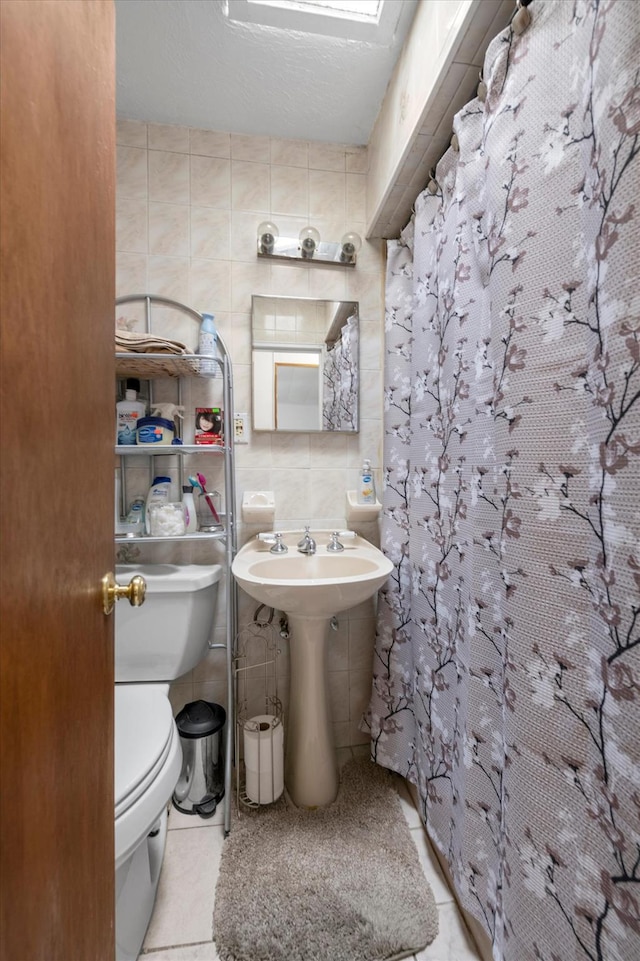 6303 74th St, Middle Village, NY 11379 - full bathroom with tile walls, tile patterned flooring, and curtained shower