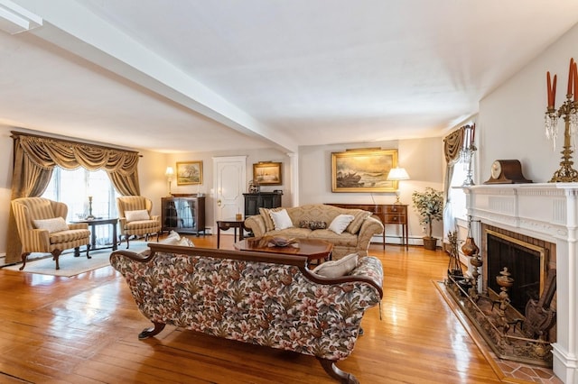 107 S Country Rd, East Patchogue, NY 11772 - living room featuring light wood-style flooring, a fireplace, and baseboard heating