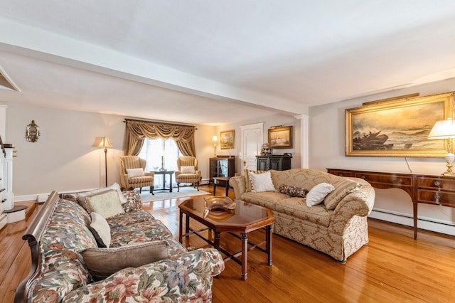 107 S Country Rd, East Patchogue, NY 11772 - living area featuring wood finished floors and a baseboard radiator