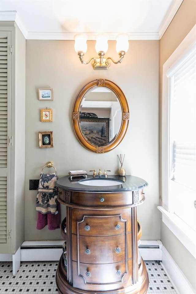 107 S Country Rd, East Patchogue, NY 11772 - bathroom with vanity, a baseboard heating unit, crown molding, and tile patterned floors