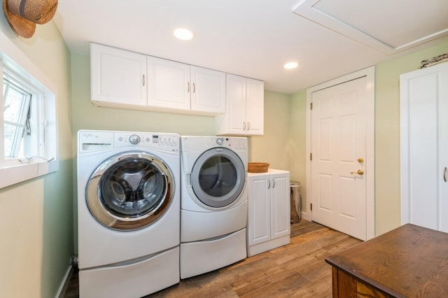 107 S Country Rd, East Patchogue, NY 11772 - washroom featuring cabinet space, separate washer and dryer, light wood-style flooring, and recessed lighting