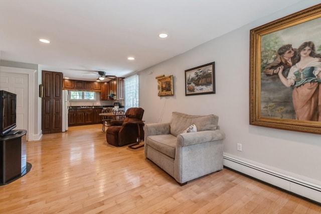 107 S Country Rd, East Patchogue, NY 11772 - living area featuring a baseboard heating unit, light wood-style flooring, recessed lighting, and a ceiling fan