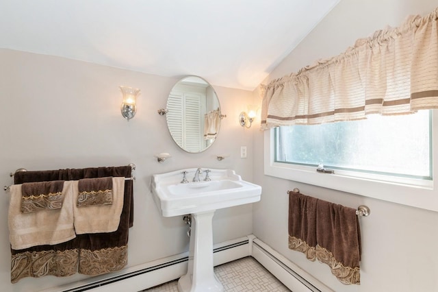 107 S Country Rd, East Patchogue, NY 11772 - bathroom with lofted ceiling, a baseboard heating unit, and tile patterned floors