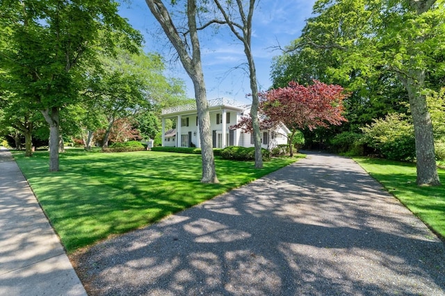 107 S Country Rd, East Patchogue, NY 11772 - greek revival house with a front yard and driveway