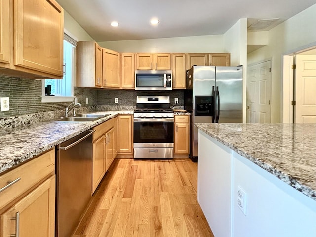 167 Benner Rd, Red Hook, NY 12571 - kitchen featuring appliances with stainless steel finishes, light brown cabinets, light wood finished floors, light stone counters, and recessed lighting