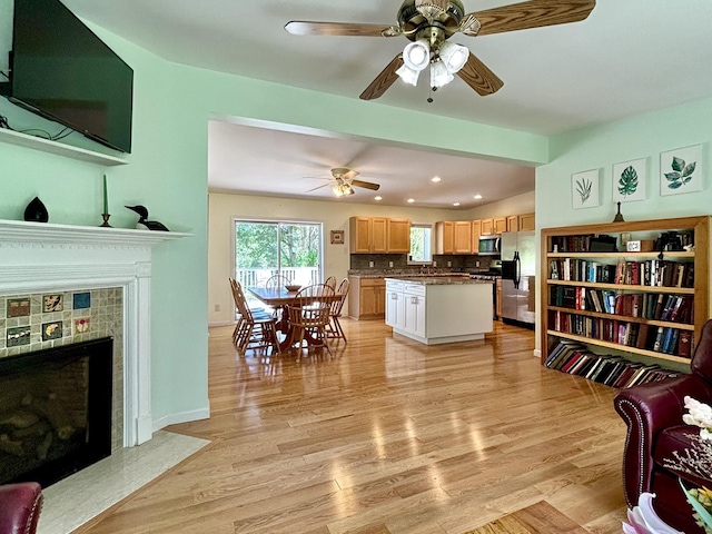 167 Benner Rd, Red Hook, NY 12571 - living area featuring a ceiling fan, light wood finished floors, vaulted ceiling, recessed lighting, and a fireplace