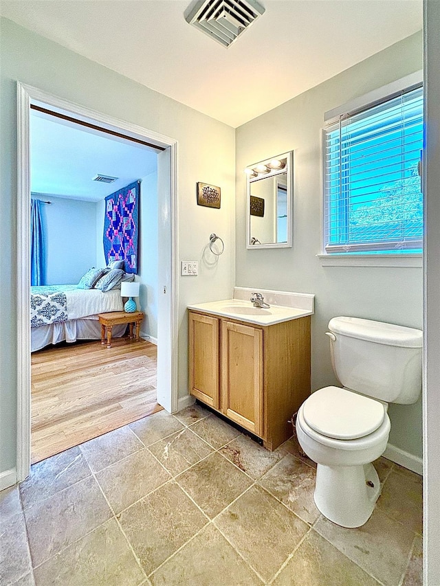 167 Benner Rd, Red Hook, NY 12571 - bathroom with vanity, ensuite bathroom, and stone finish floors