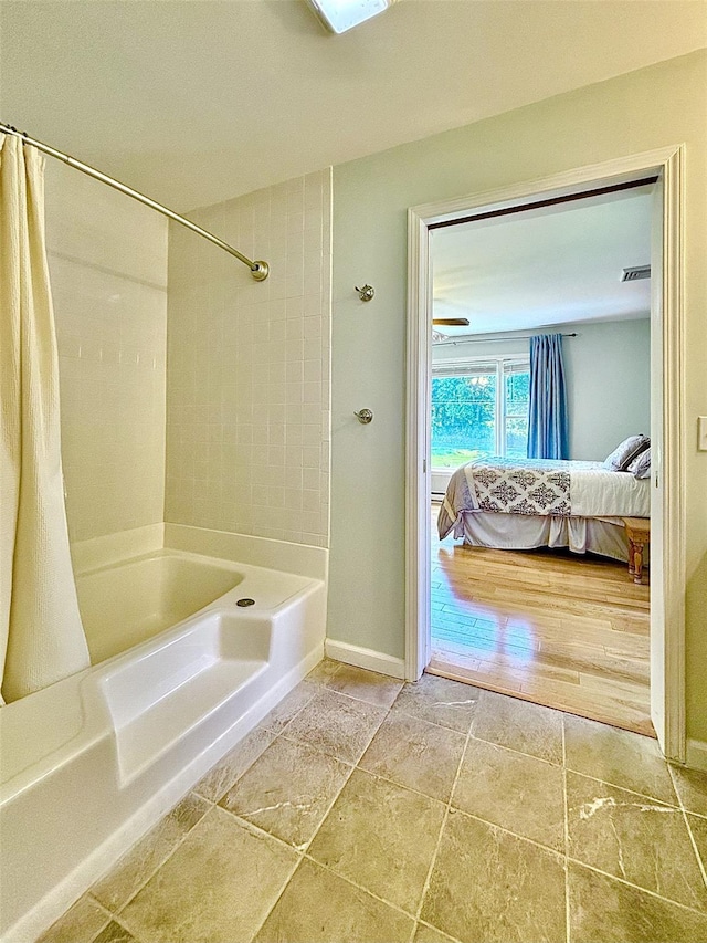 167 Benner Rd, Red Hook, NY 12571 - bathroom featuring ensuite bath, shower / bath combination with curtain, and stone finish floors