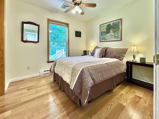 167 Benner Rd, Red Hook, NY 12571 - bedroom with light wood-type flooring, baseboard heating, and ceiling fan