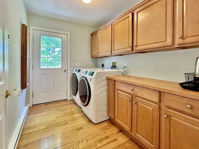 167 Benner Rd, Red Hook, NY 12571 - laundry room featuring a baseboard radiator, cabinet space, light wood-type flooring, and washer and dryer