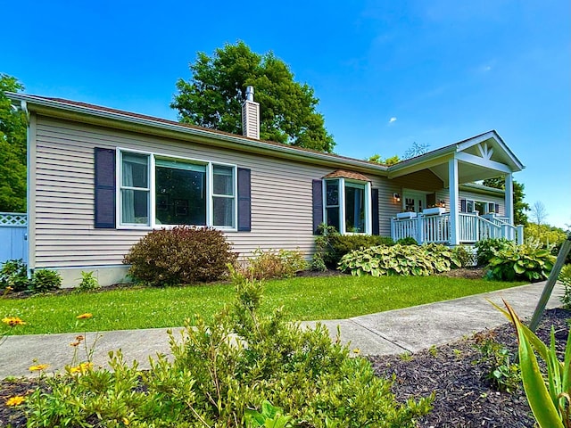 167 Benner Rd, Red Hook, NY 12571 - view of front of home with a chimney, a front yard, and a porch
